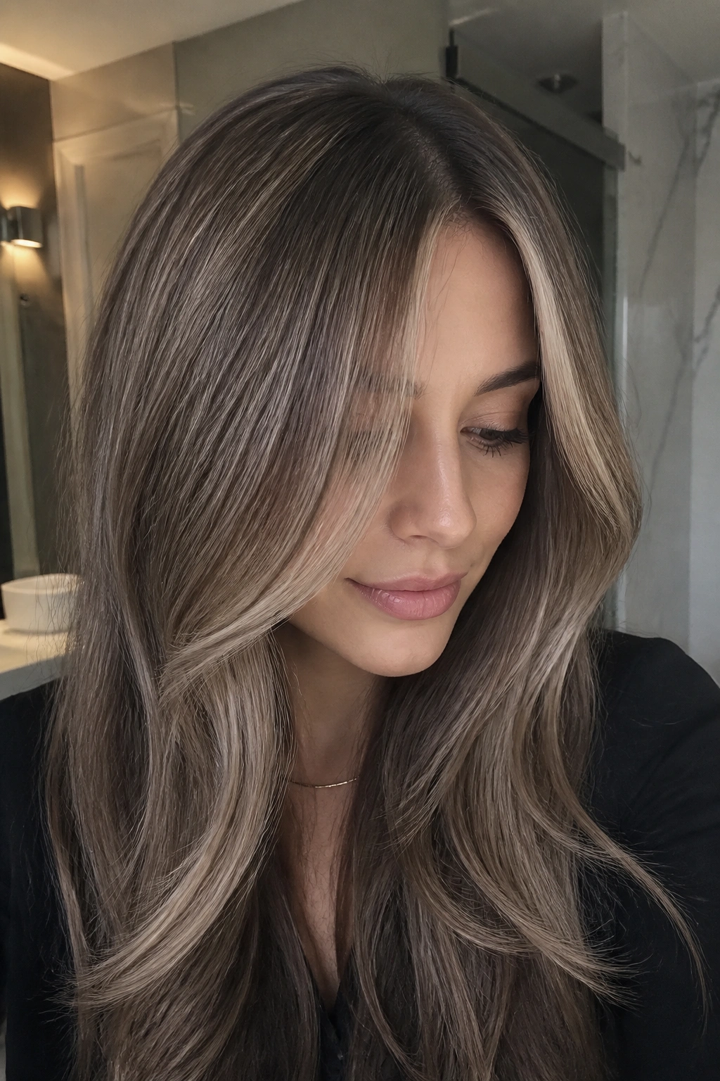 Close-up of a real woman with ash blonde veils on cool brown hair