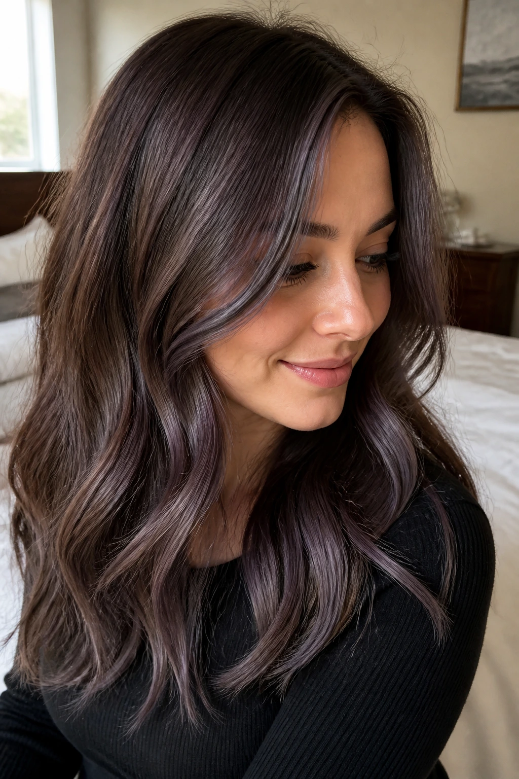 Close-up portrait of a person with ash brown hair and smoky purple lowlights in natural light