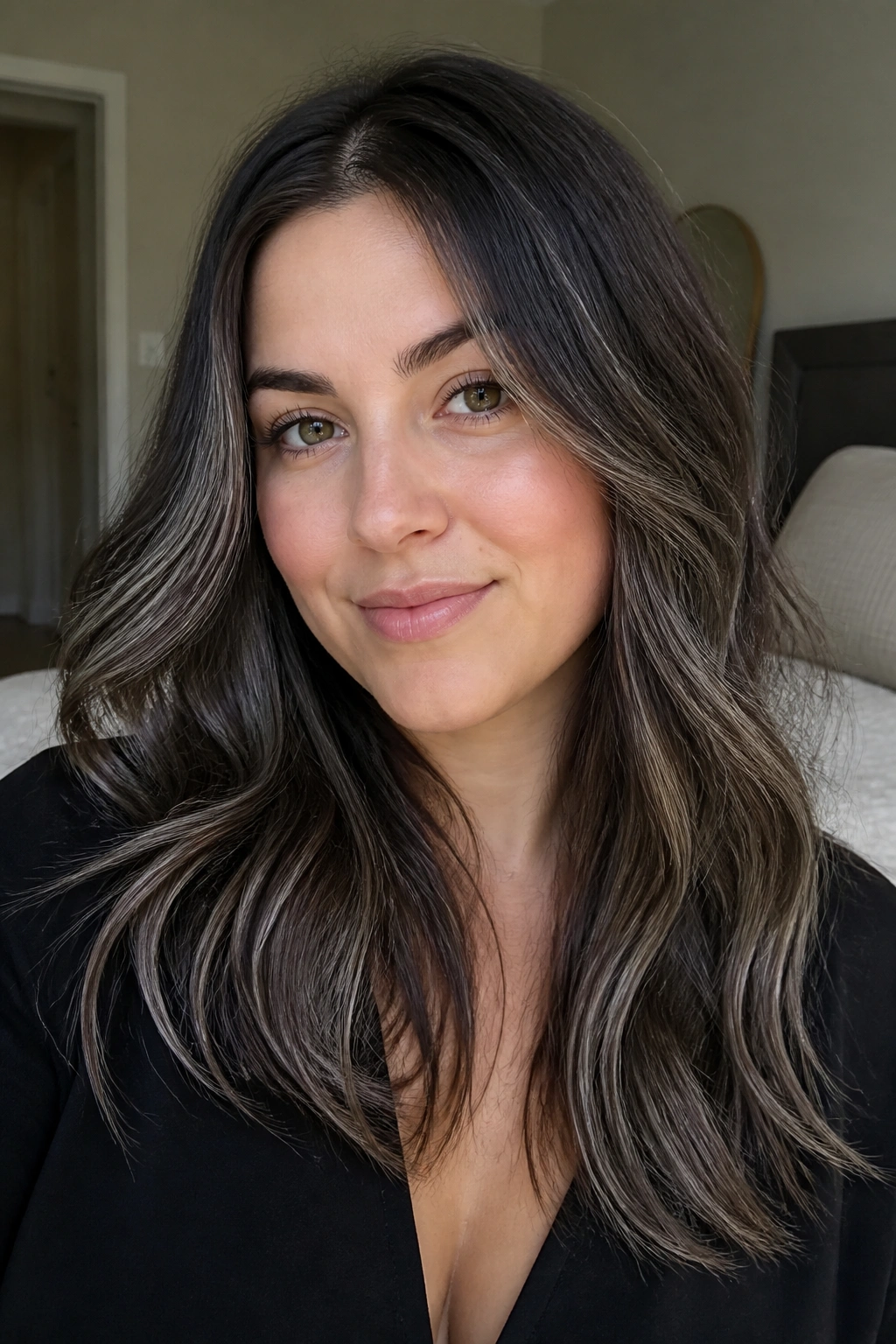 Close-up of a real woman with ash brown highlights shaping the outline