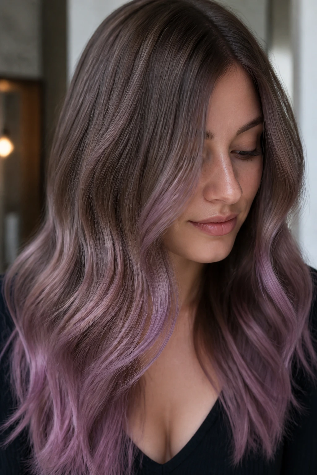 Close-up portrait of a real person with ash brown to mauve hair lengths