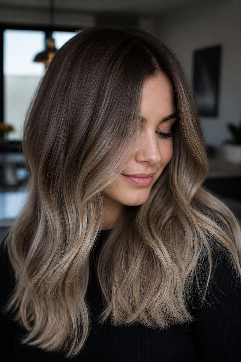Close-up of cool ash brown to mushroom blonde ombre on a real person
