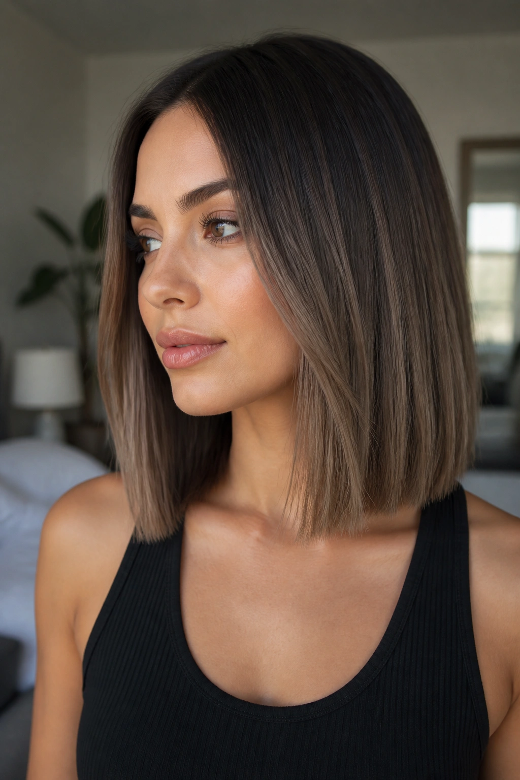 Close-up of ash brown to mushroom brown blunt lob on a real person