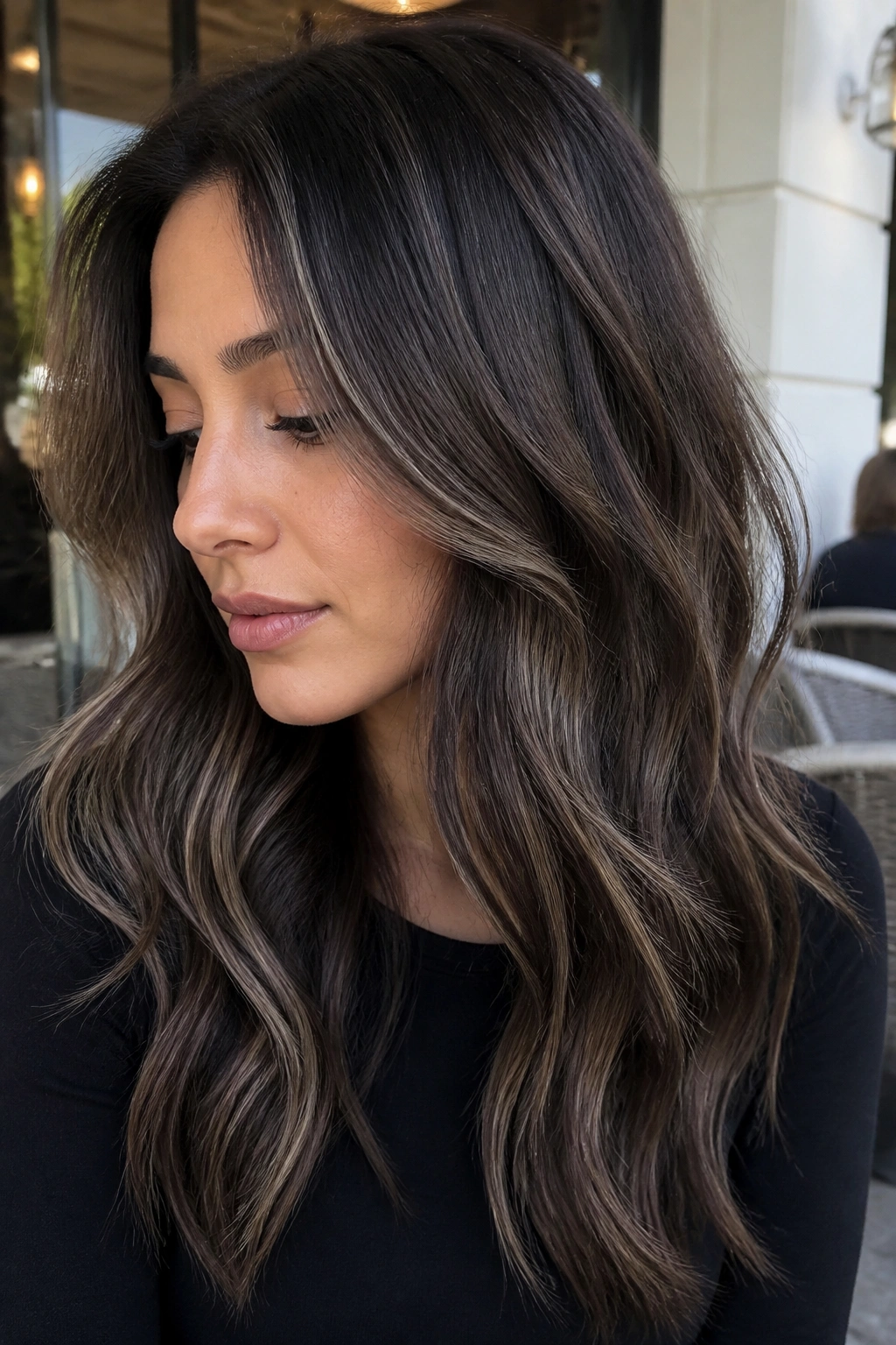 Brunette portrait with ash brown smoky balayage for a cool look.