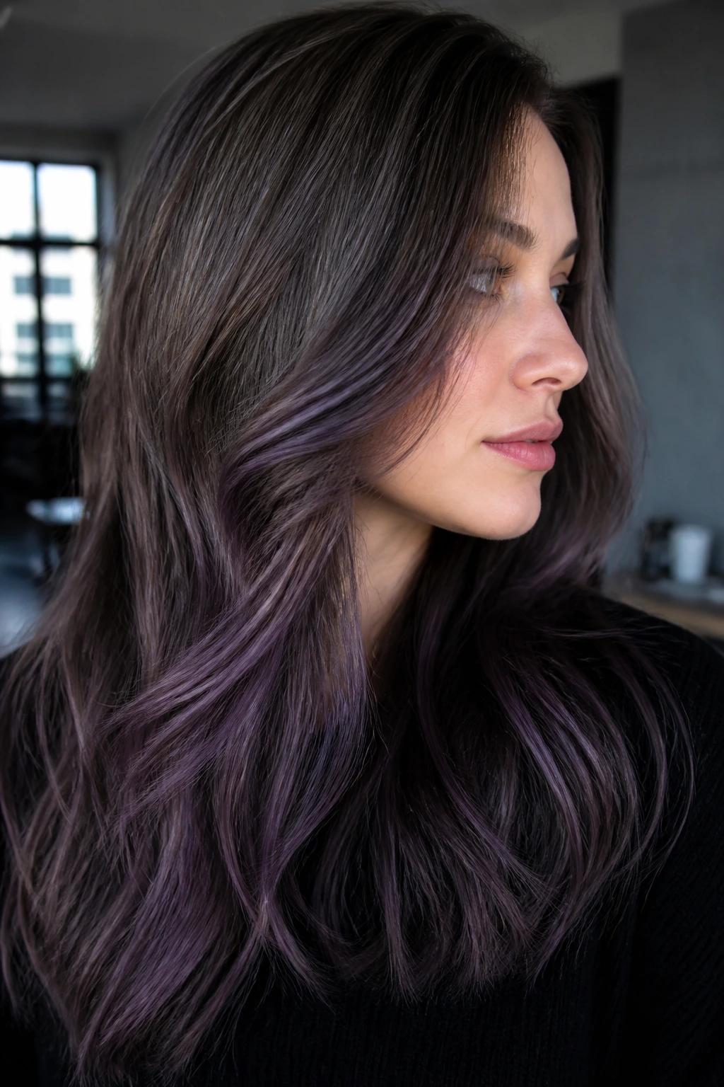 Portrait of a person with ash brown hair and violet smoky highlights
