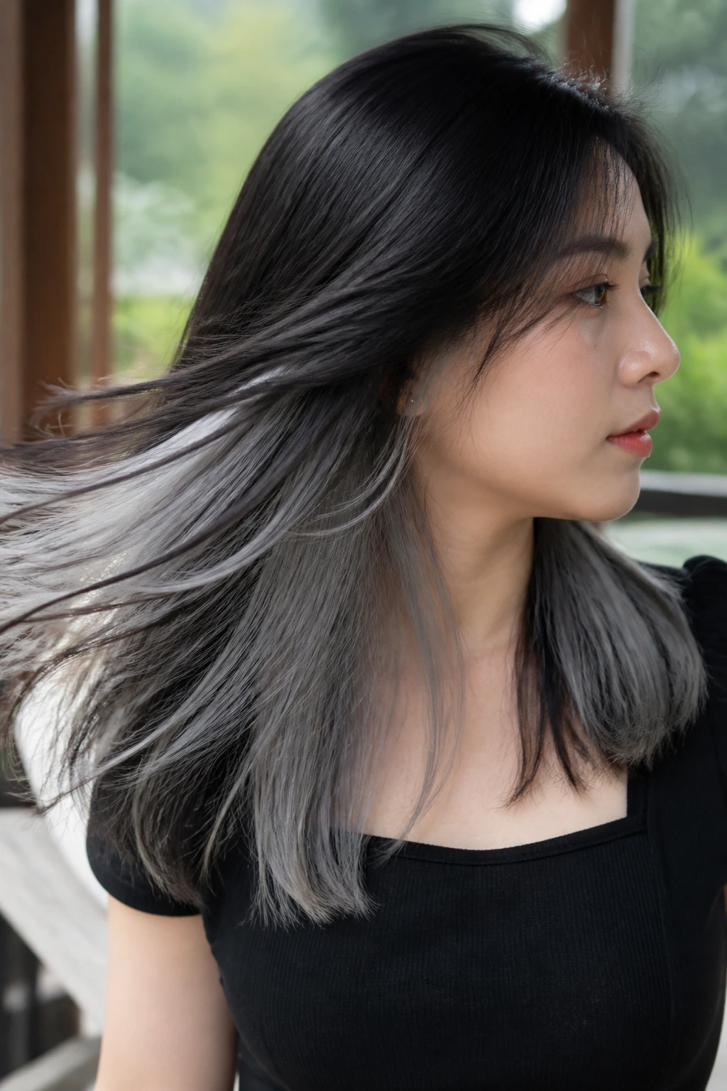 Portrait of a real person showing ash-gray underlights beneath black top layer