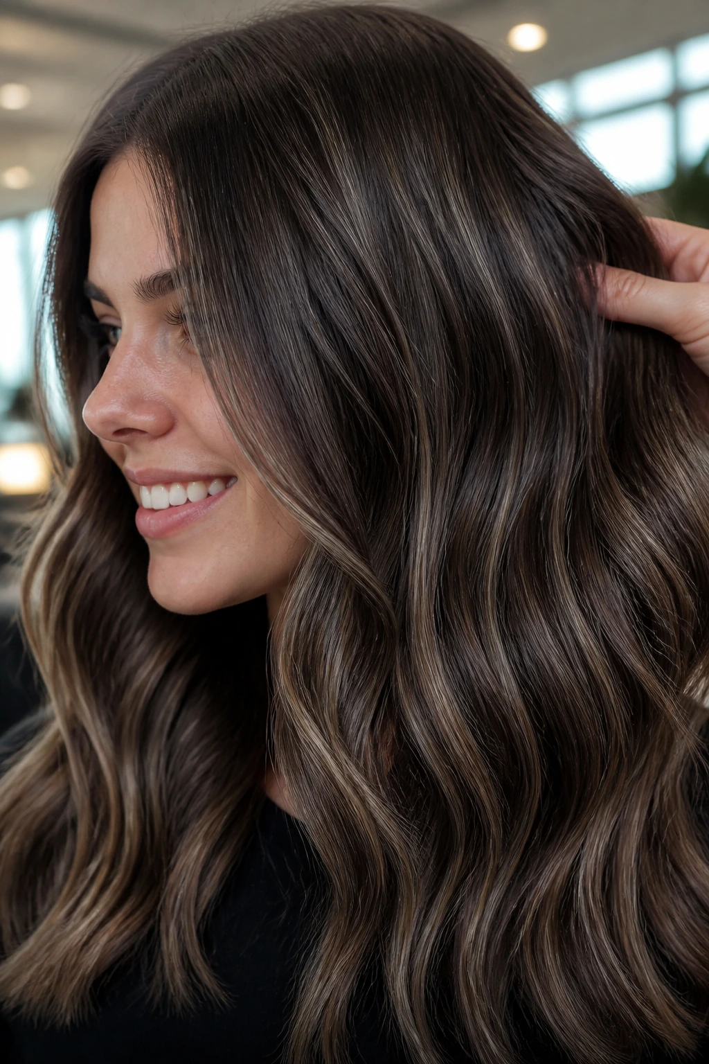 Close-up portrait of brunette hair with ash-toned dimensional highlights