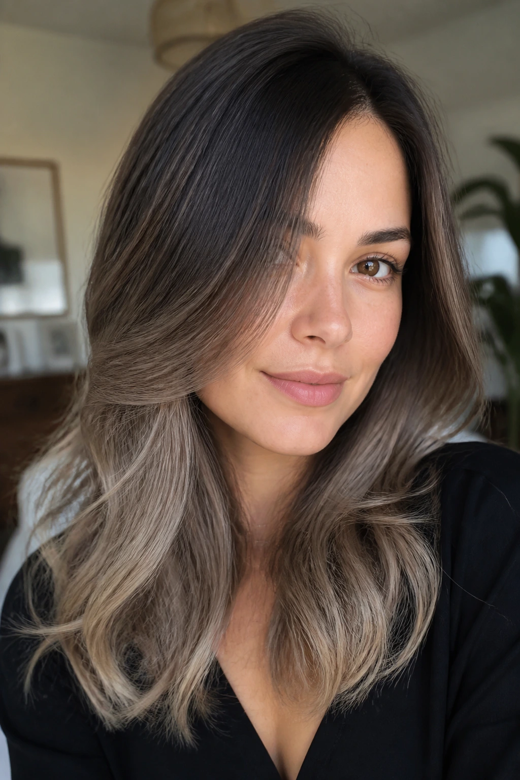 Portrait of a real woman with off-center ash brown ombré shifting the eye