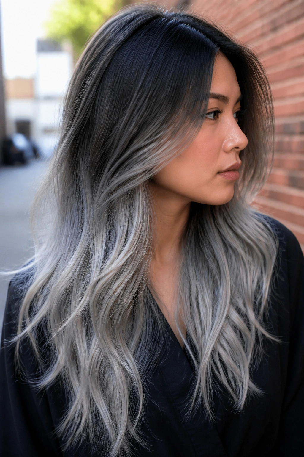 Portrait of a real person showing ash ombré from roots to ends
