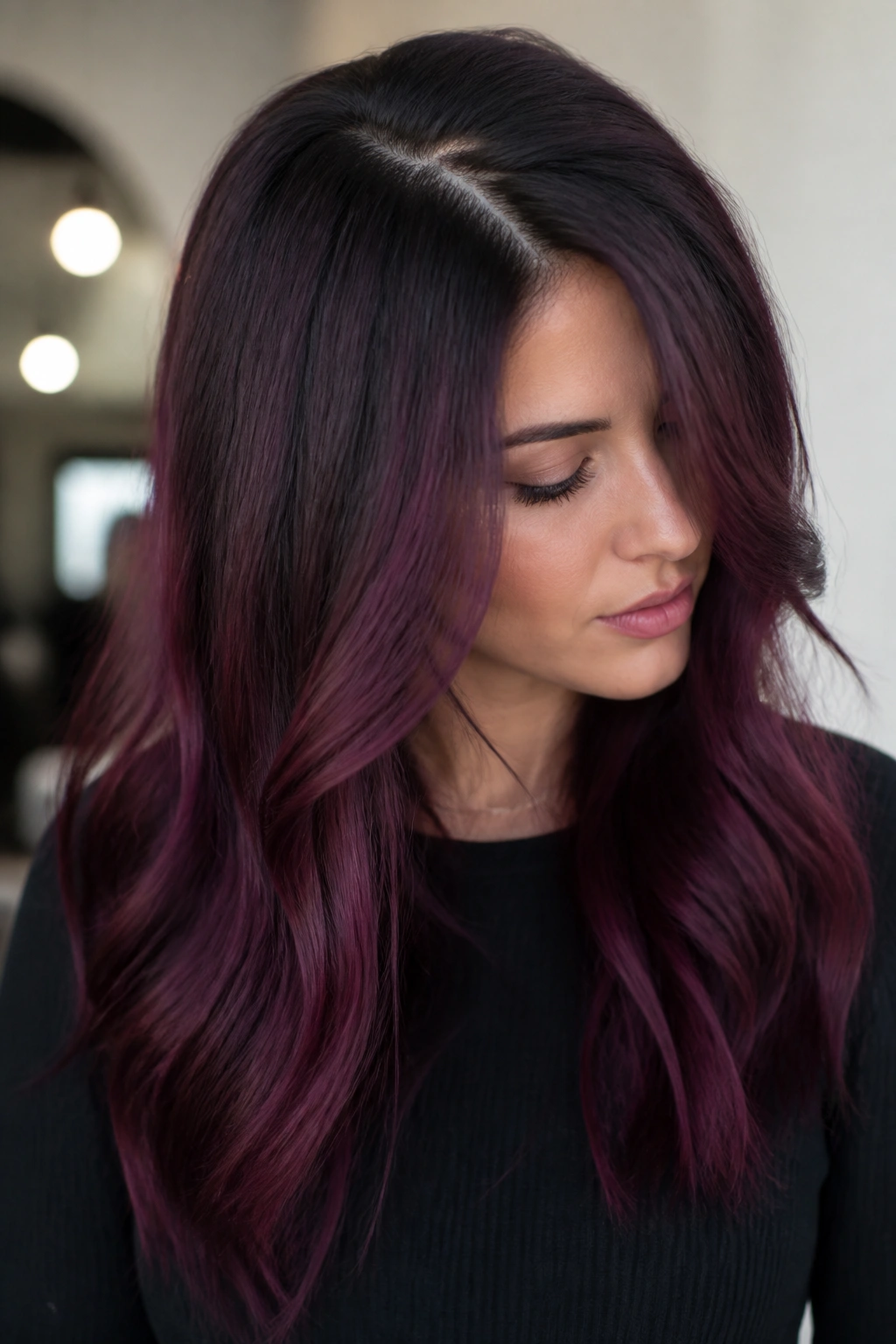 Close-up of hair showing ashy root shadow blending into black cherry