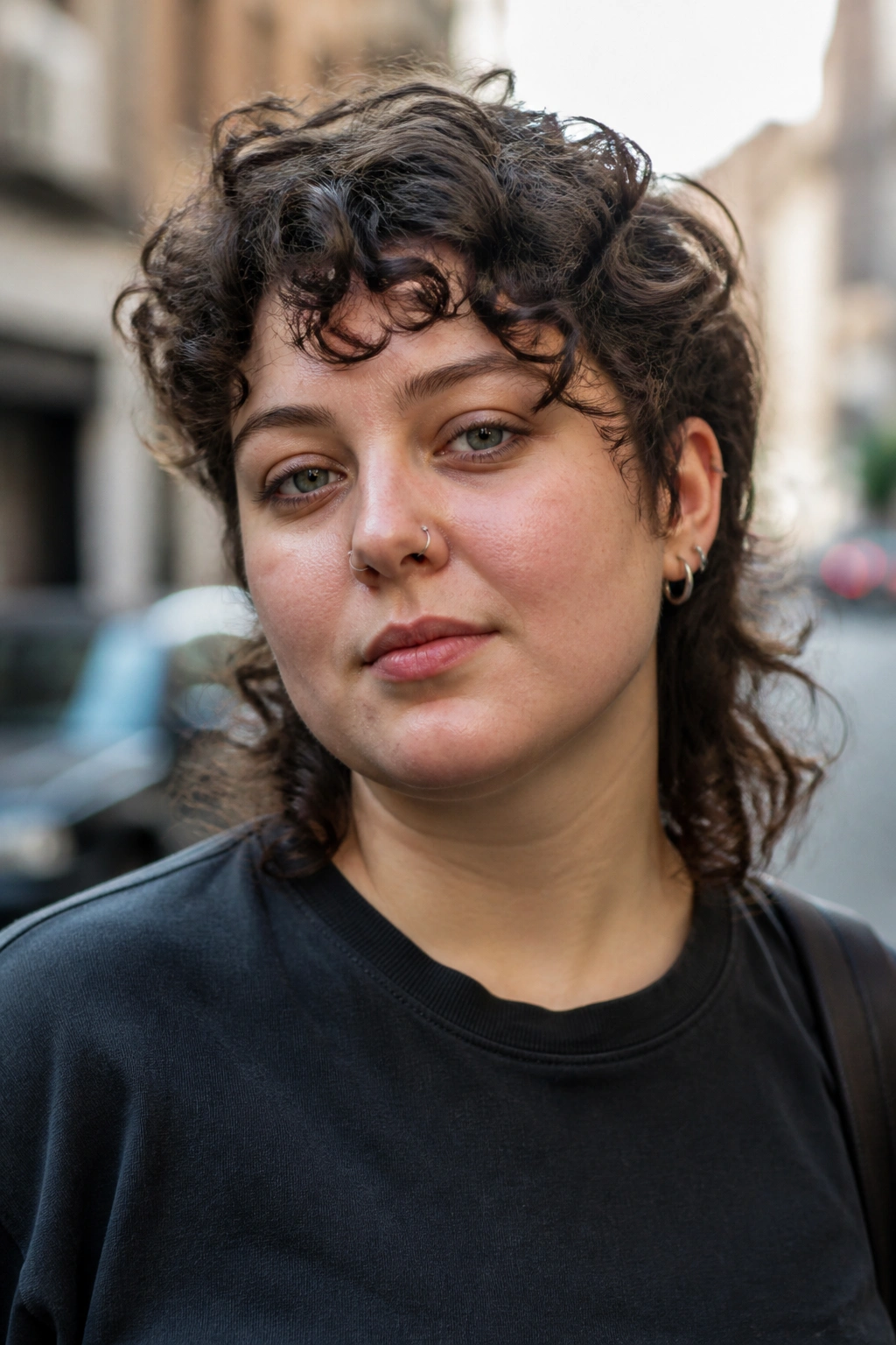 Portrait of a real person with asymmetrical curly mullet on a round-face silhouette