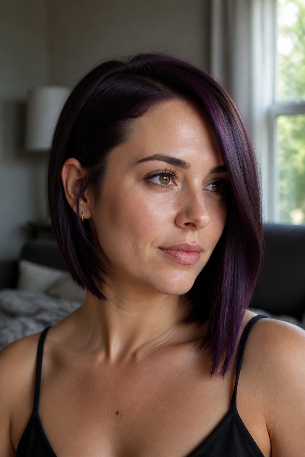 Portrait of a real woman with an asymmetrical eggplant bob
