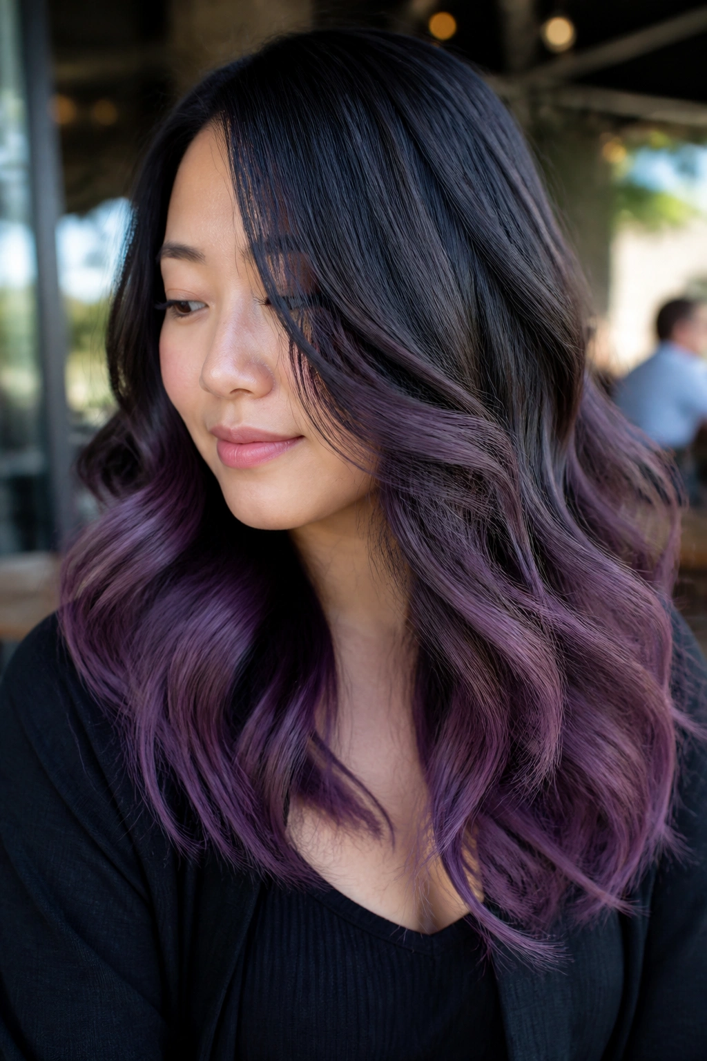 Portrait of a real woman with smoky amethyst balayage at the ends.