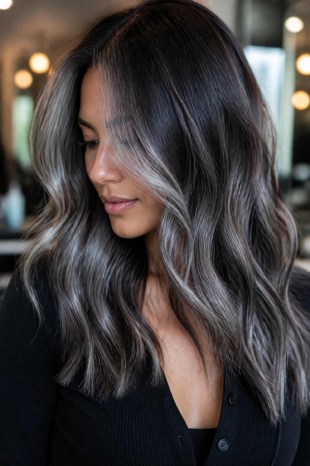 Close-up of metallic gray balayage on dark brunette hair