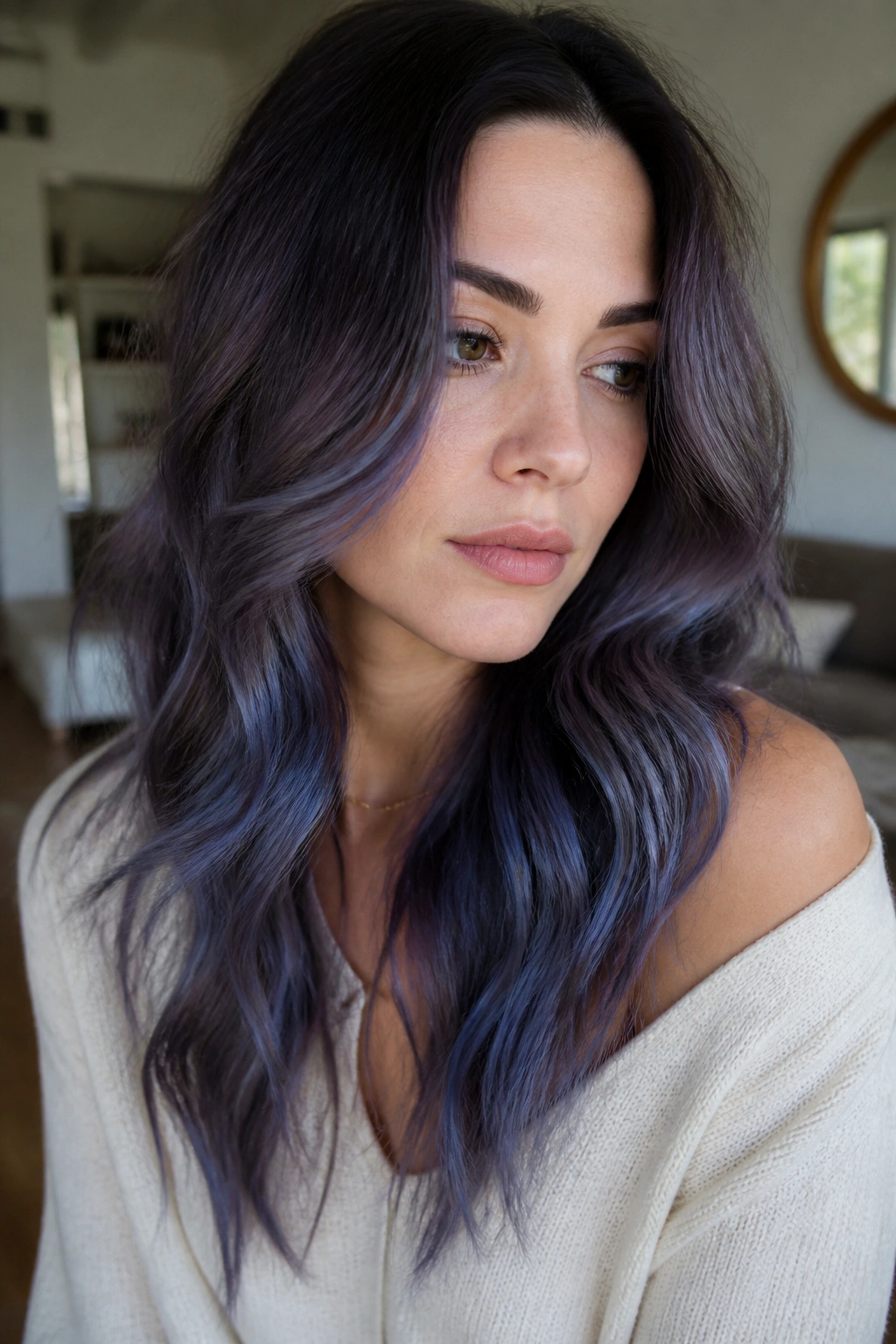 Portrait of a person with smoky iris balayage on mid-lengths and ends.