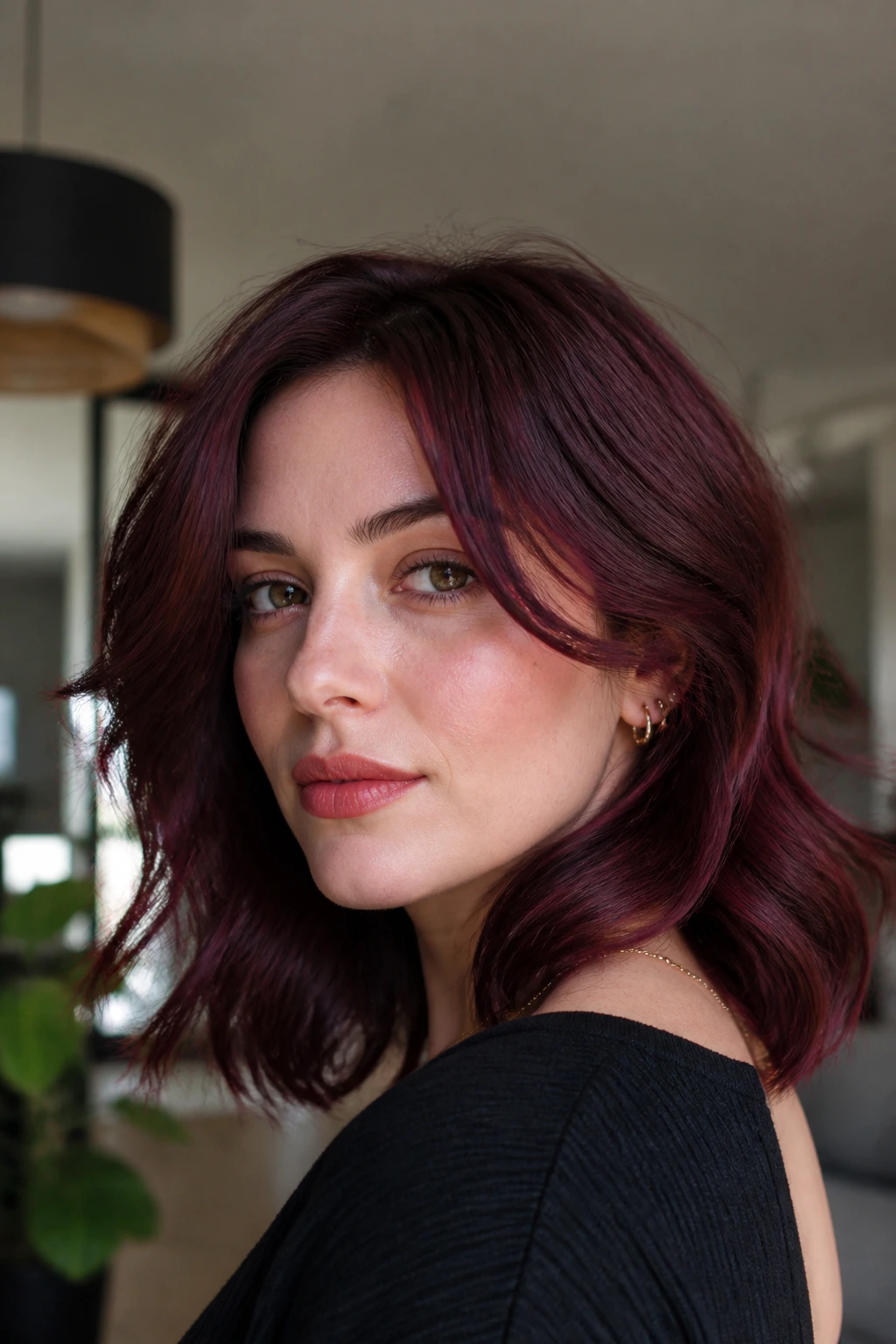 Close-up of a real woman with beetroot-brown hair on a short-to-medium cut