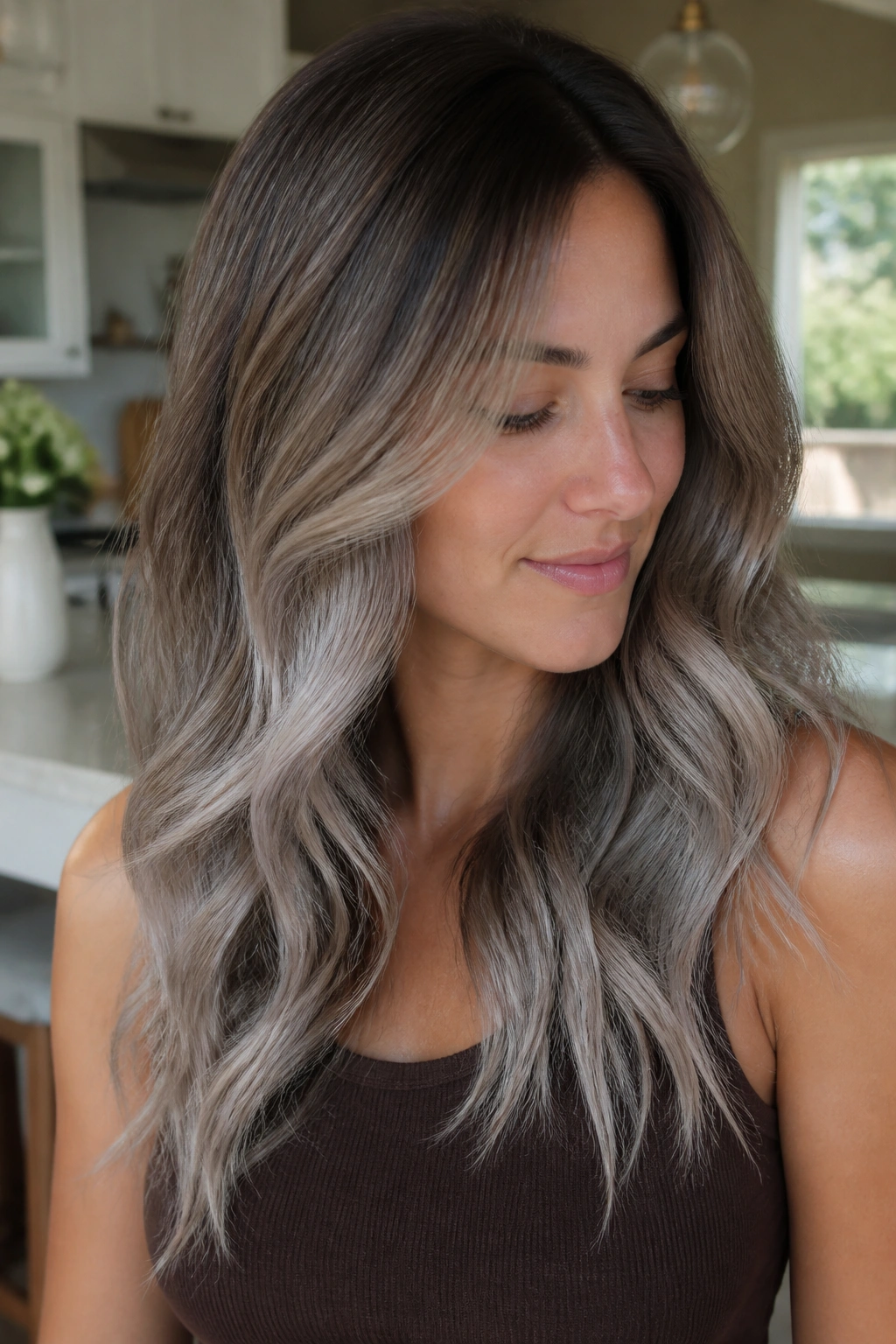 Medium-brown hair with beige-to-silver balayage in a portrait