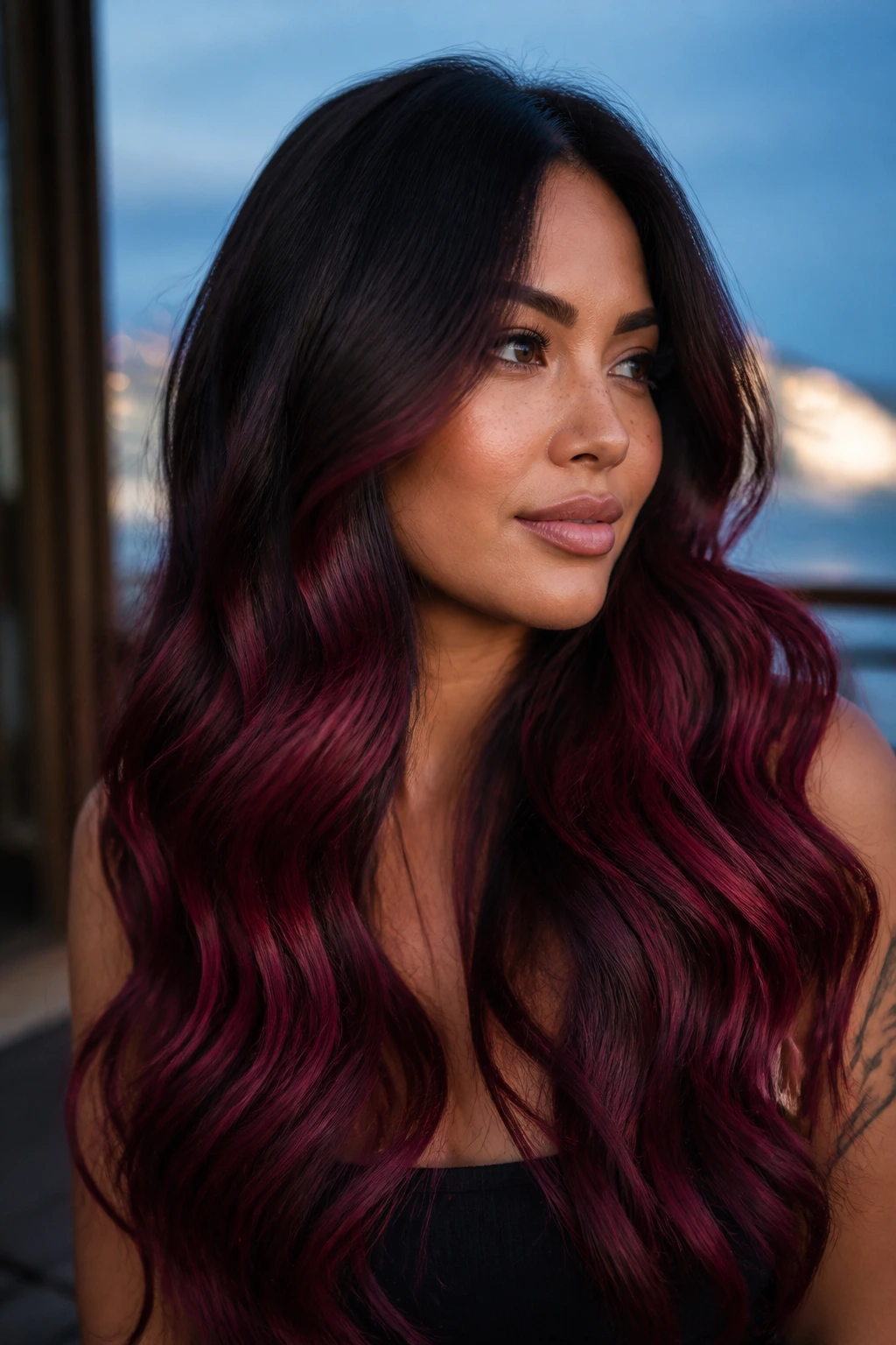 Close-up of long black hair with berry-red mermaid waves