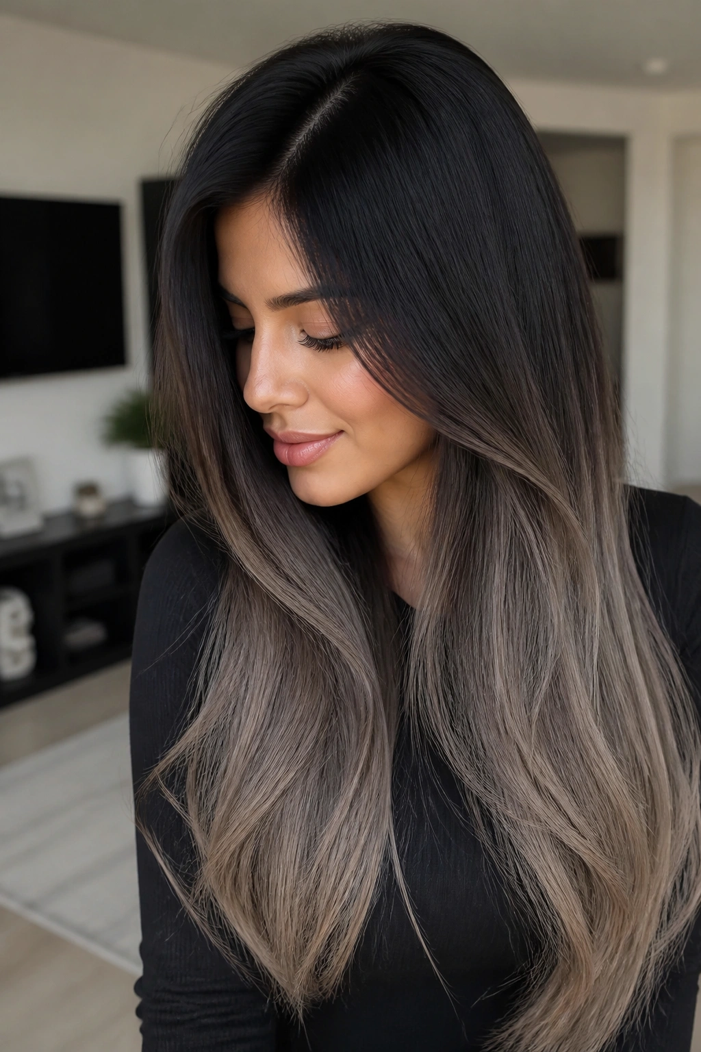 Close-up of long hair from black roots to ash brown ends on a real person