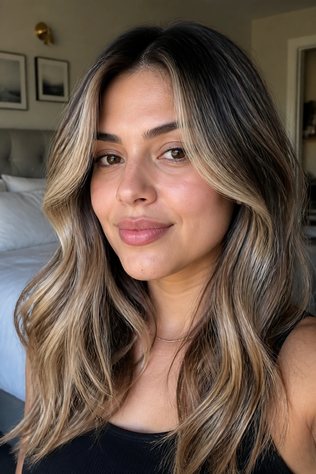 Close-up of a real person showing a black-and-blonde blend with lifted face framing