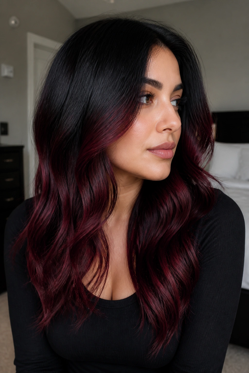 Close-up of black cherry balayage starting below the cheekbones
