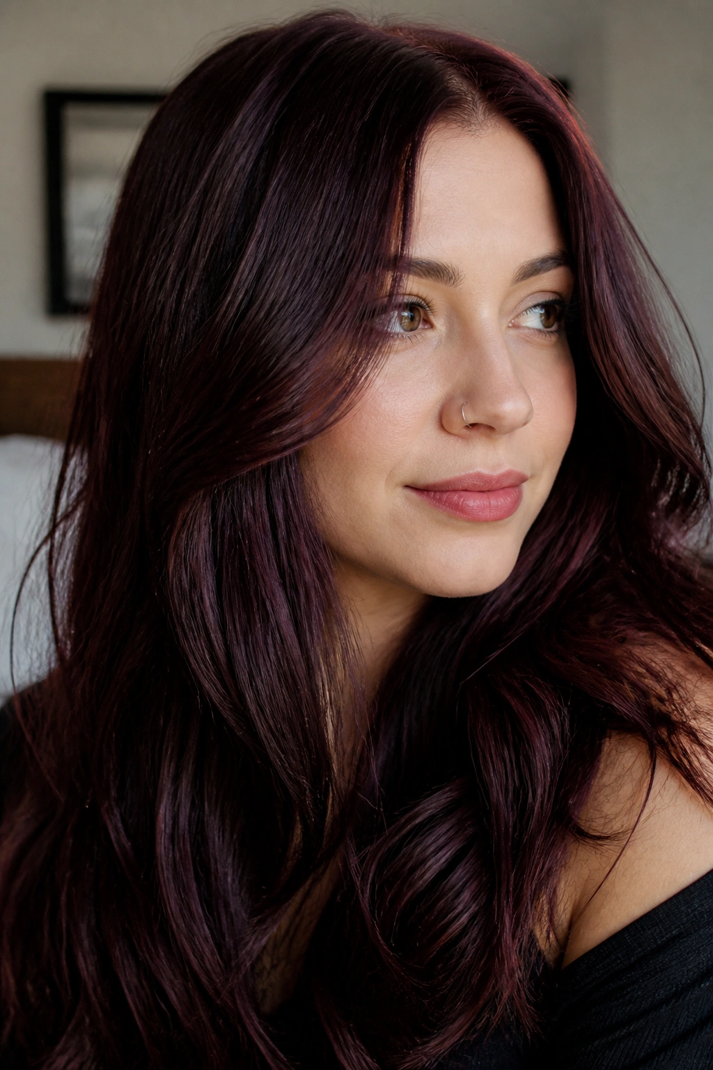 Close-up portrait of a real person with black cherry hair in cool finish