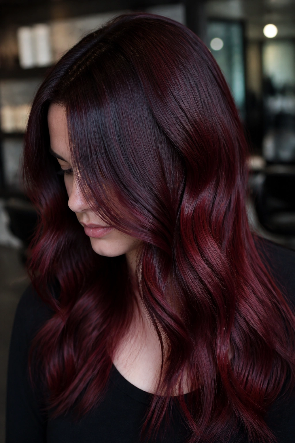 Real person with glossy Black Cherry over faded red hair—cool-toned and rich.