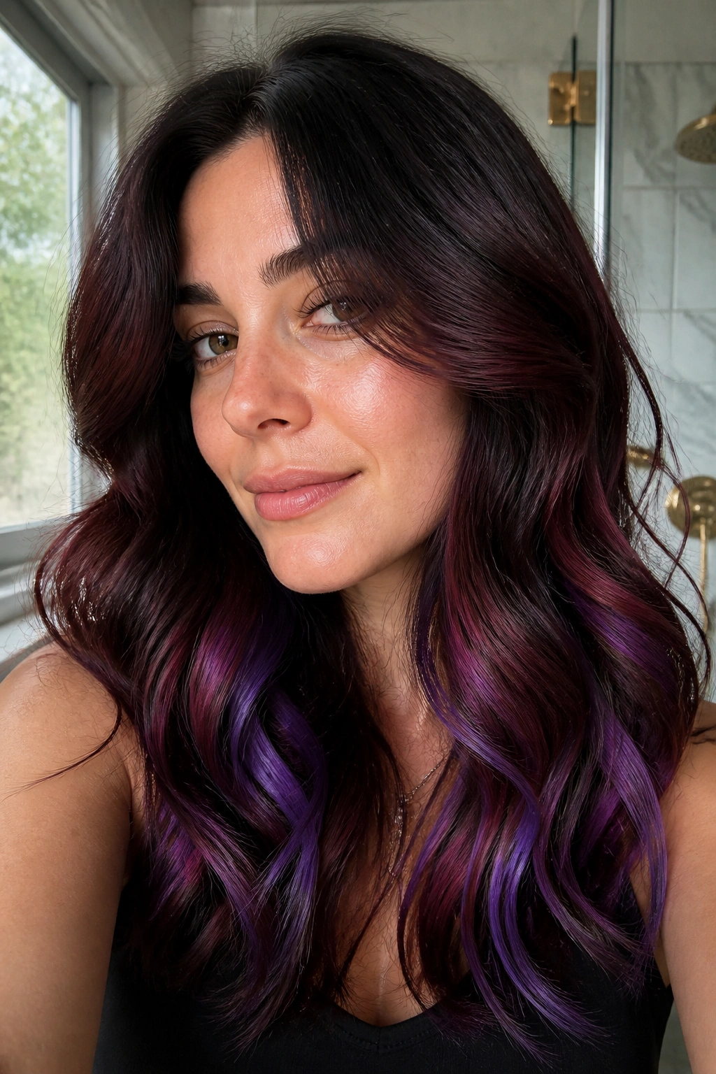 Close-up of real person with black cherry melt hair featuring deep cherry and violet ribbons