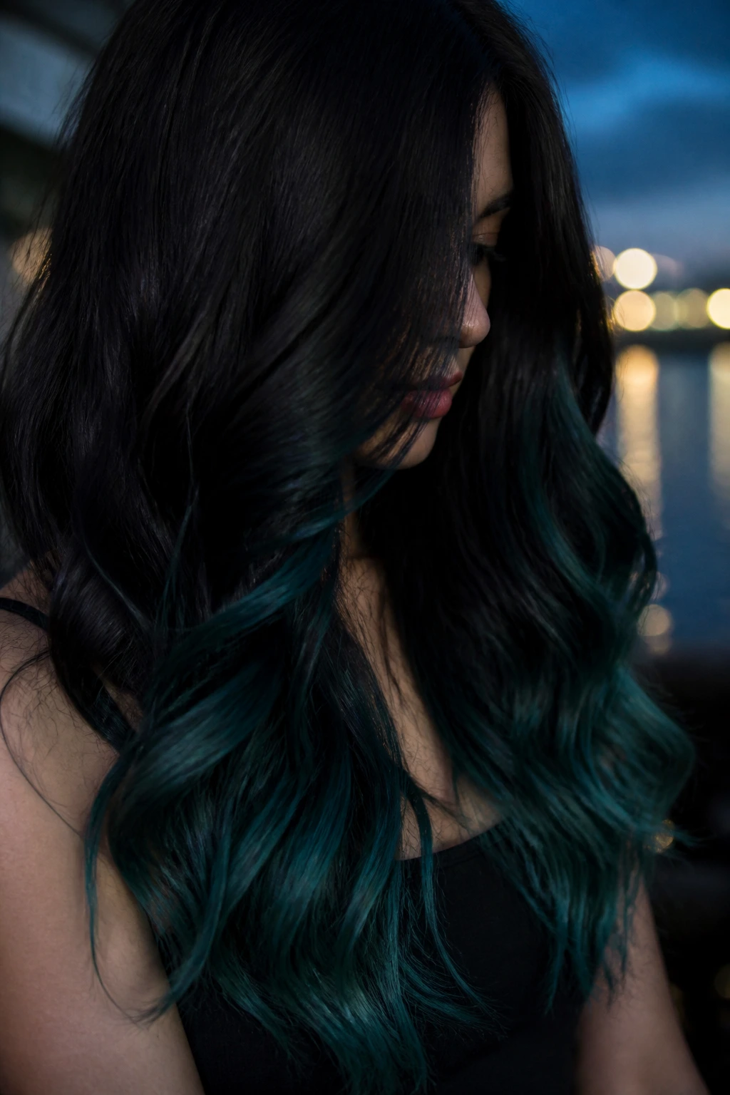 Real person with black hair ending in midnight teal ends