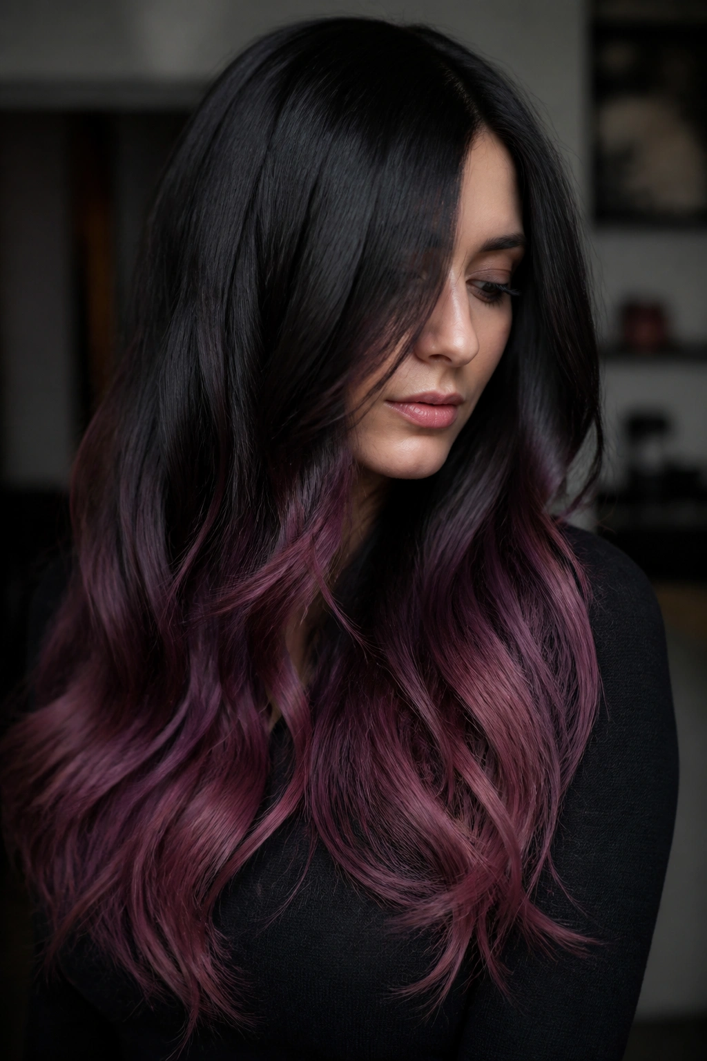 Long black hair with plum-pink blend on lower lengths.