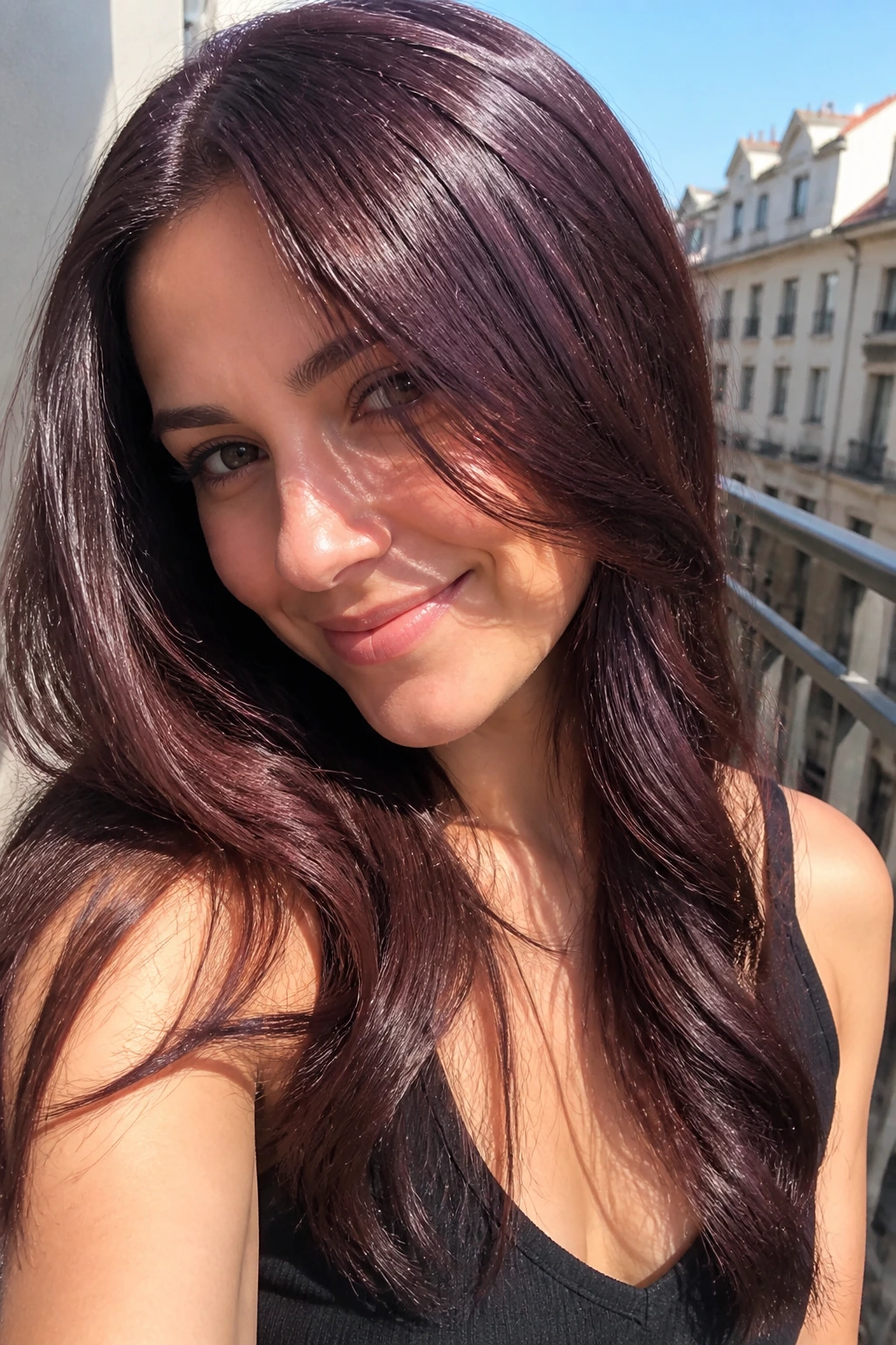 Close-up portrait of a real woman with blackberry chocolate hair outdoors