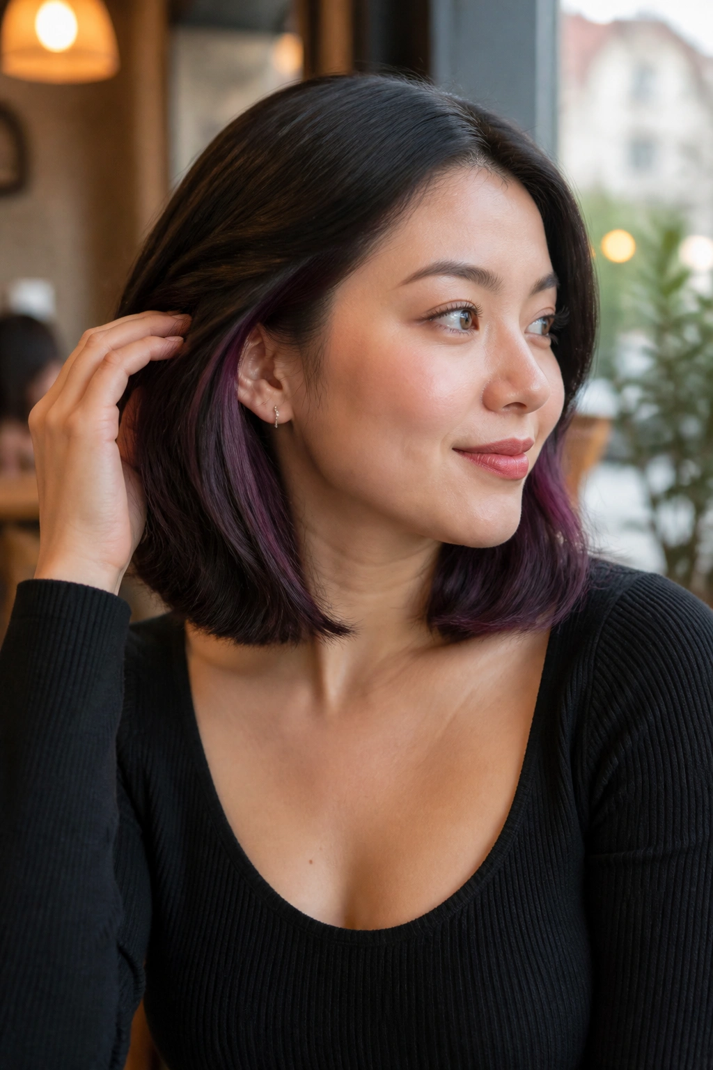 Portrait of a real woman with blackberry peekaboo on a lob
