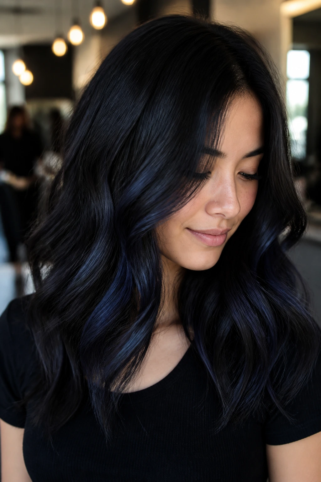 Close-up of espresso hair with blue-black whisper balayage