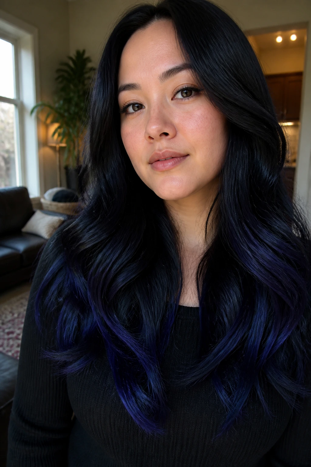 Portrait of a real woman with blue-black hair and indigo tips, glossy ombre.
