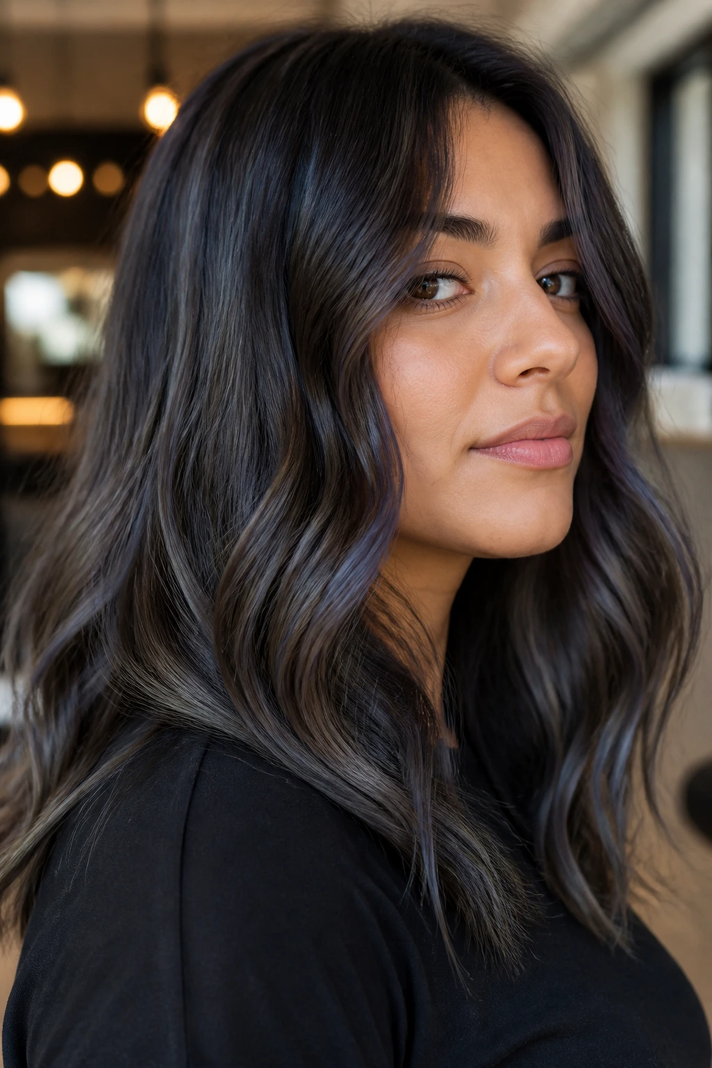 Close-up of brunette with blue-gray ash highlights.