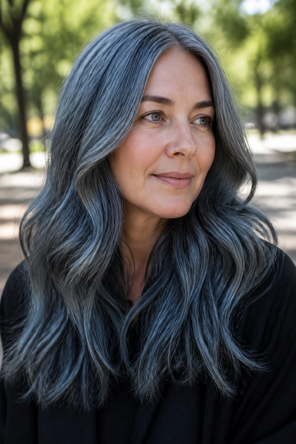 Real woman with blue-gray metallic waves in soft natural light