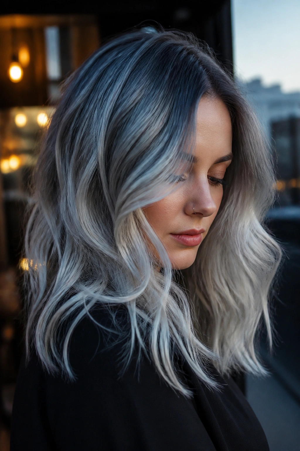 Close-up portrait of a real person with blue-gray silver melt hair