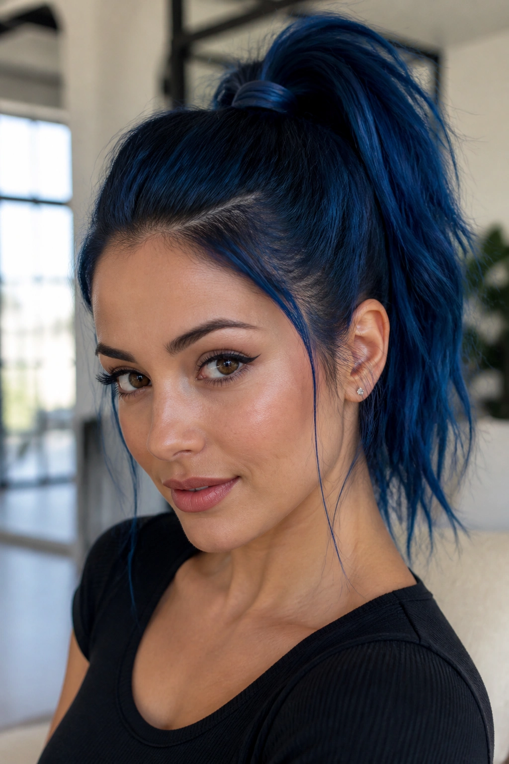 Portrait of a woman with a high blue ponytail and crown lift