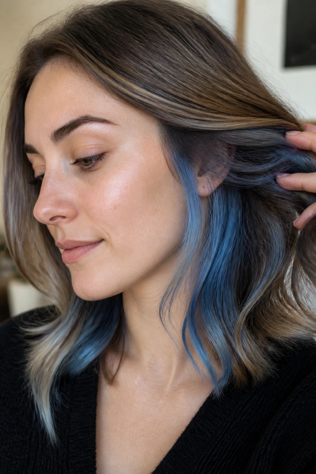 Close-up portrait of a real person with blue smoke underlayer peeking through hair near the jaw