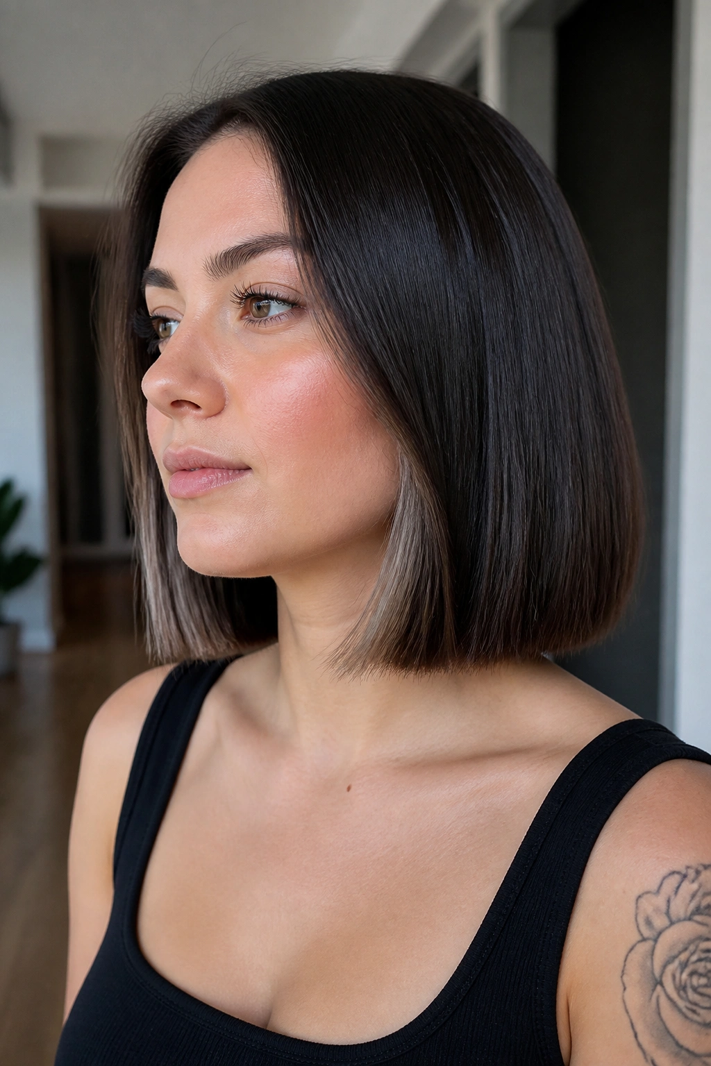 Close-up of a real woman with blunt medium bob and hidden internal layers