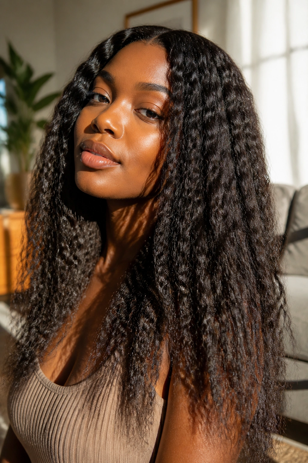 Close-up of a real woman's braid-out waves filling the frame