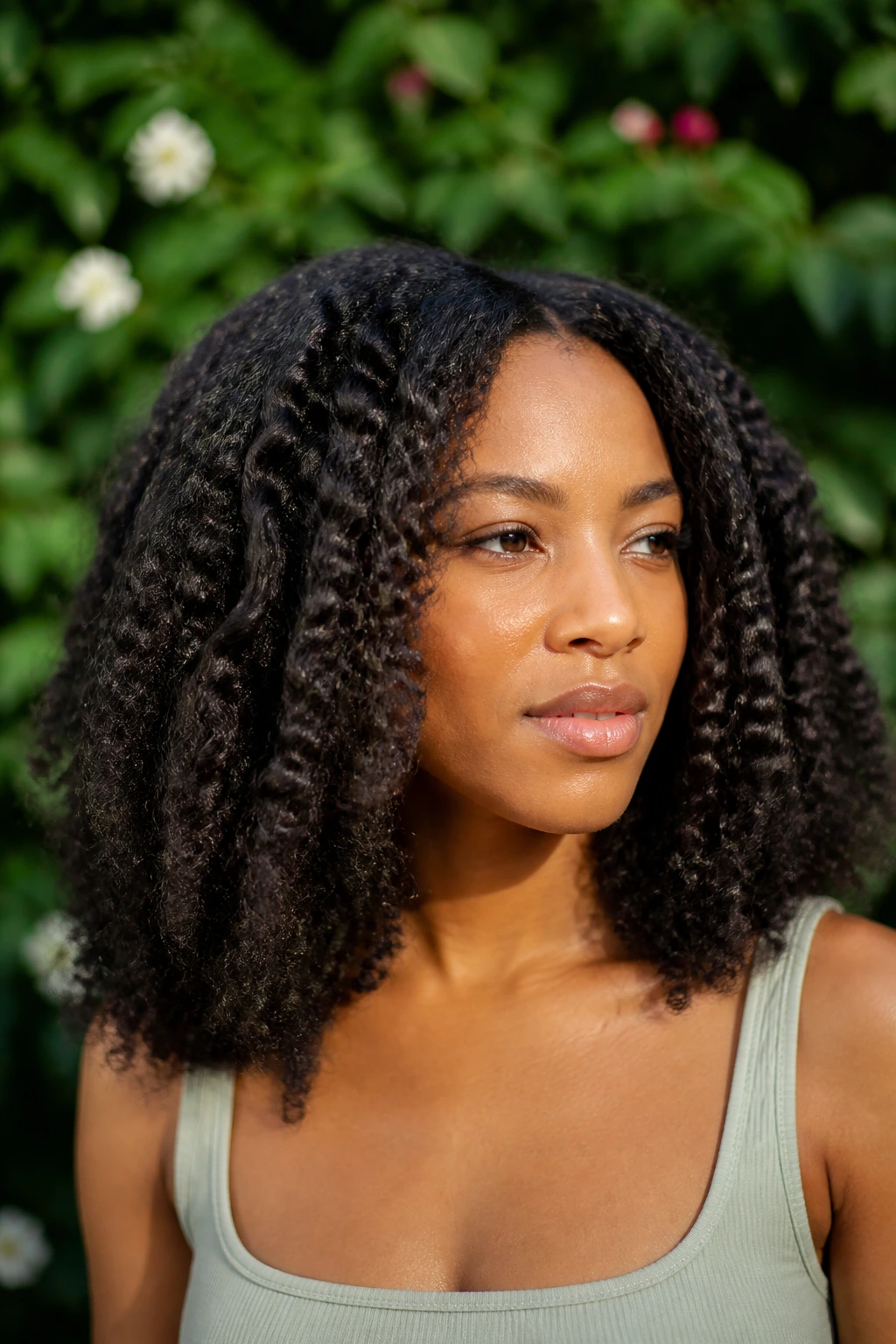 Close-up portrait of a real woman with braid-out waves for stretch