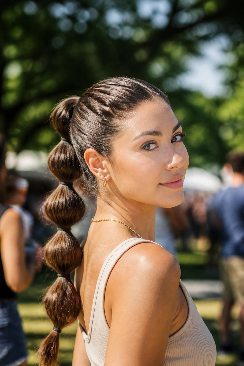Close-up of a real woman with a bubble ponytail on thick hair