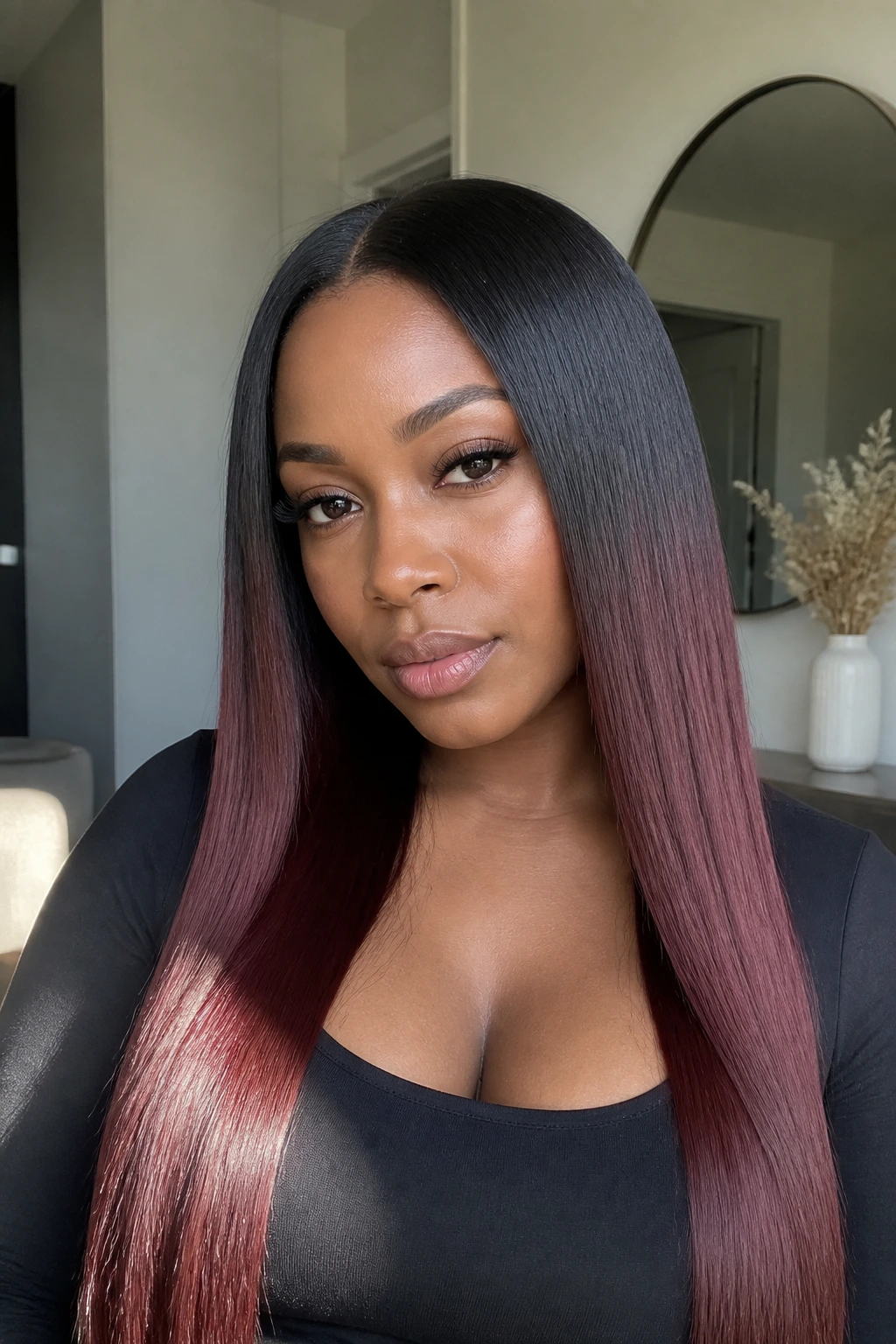 Real woman with burgundy melt on silk-pressed black hair.