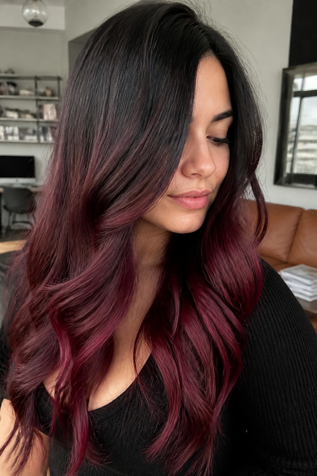 Close-up of a real woman with burgundy ombre hair and deep wine ends