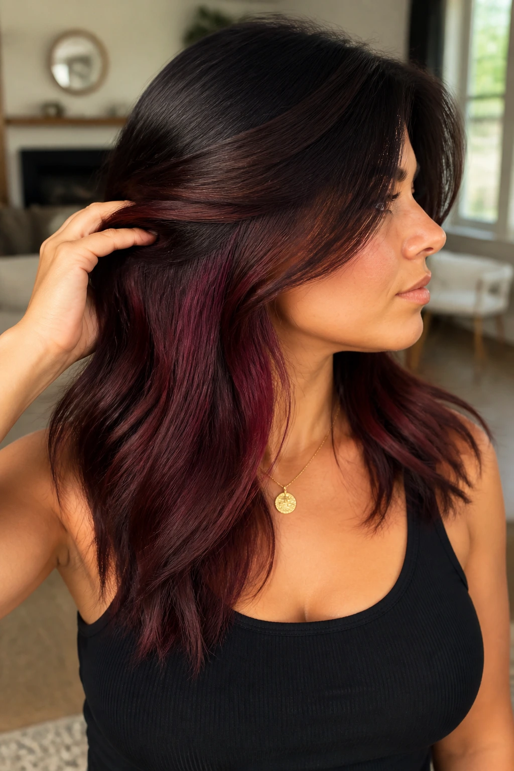 Close-up portrait of a real woman showing warm burgundy hidden panels beneath a darker outer layer