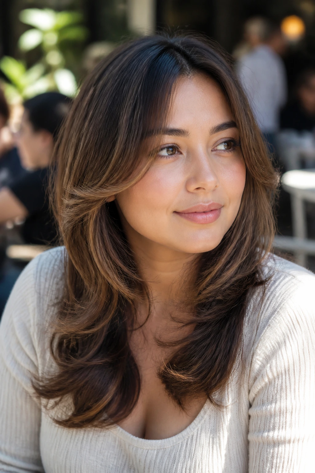 Real woman with butterfly layers around the face in sunny outdoor cafe