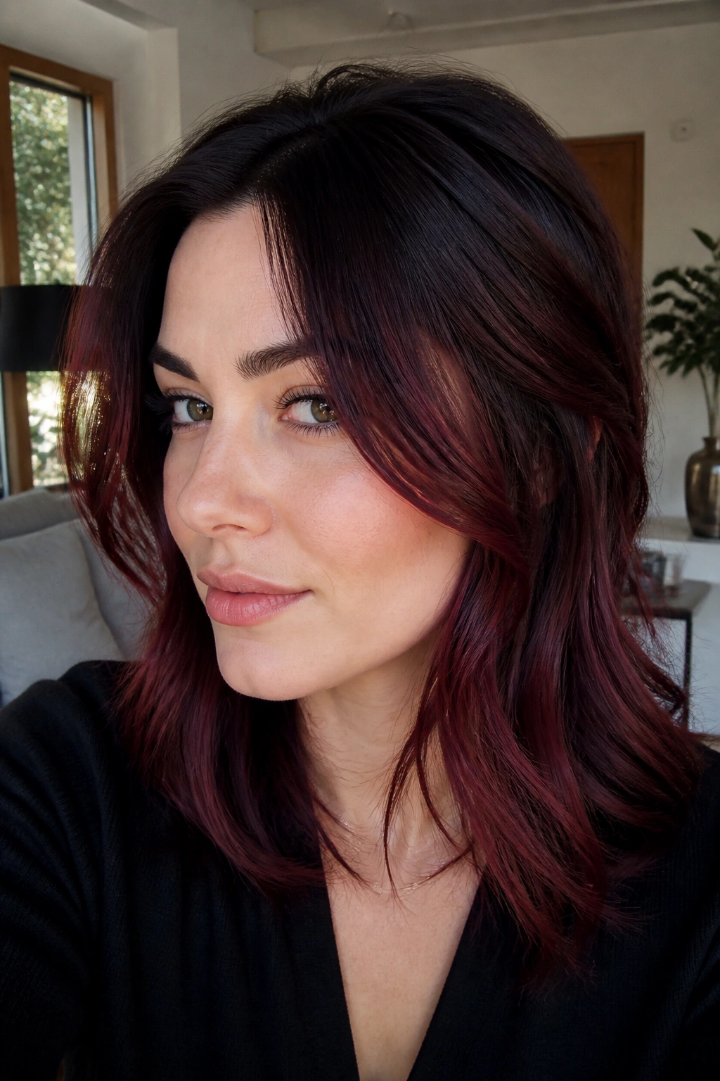 Close-up of a real woman's face with Cabernet face frame pieces near the cheeks.