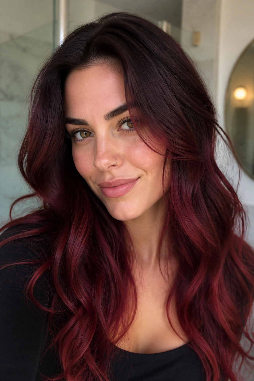Close-up of cabernet color melt from root to tip on real person