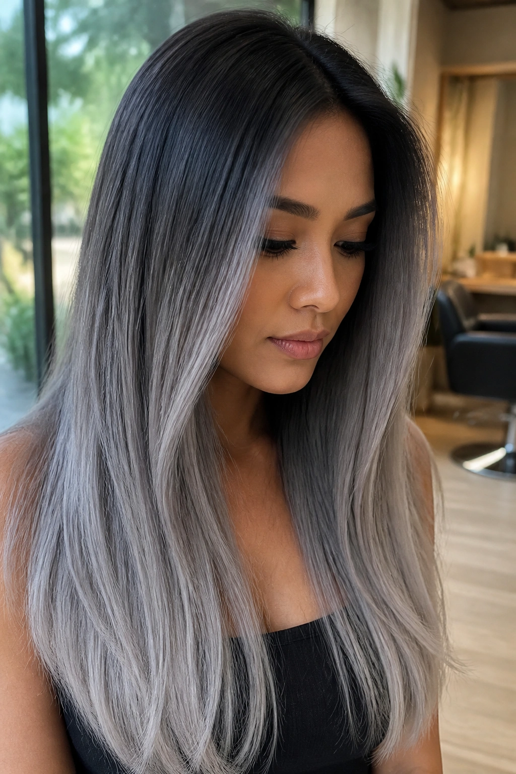 Close-up of charcoal to frosted gray ombre on long hair, real person