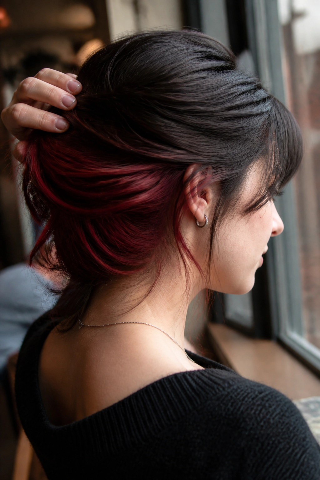 Real person showing cherry red underlights visible under dark top layer.